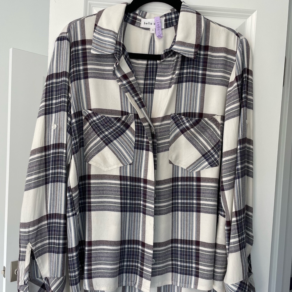 White and purple plaid button down with slit in back. Super comfy and adorable.